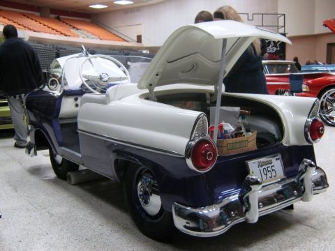 2000 Mercury Grand Marquis - Rear view of a two-tone 1955 Ford Fairlane Crown Victoria at a car show, trunk open.