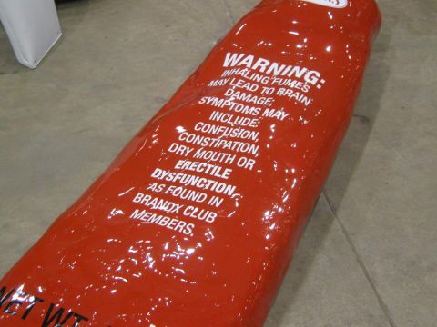 2000 Mercury Grand Marquis - A red tube with prominent white text detailing warnings and symptoms is visible on a floor.