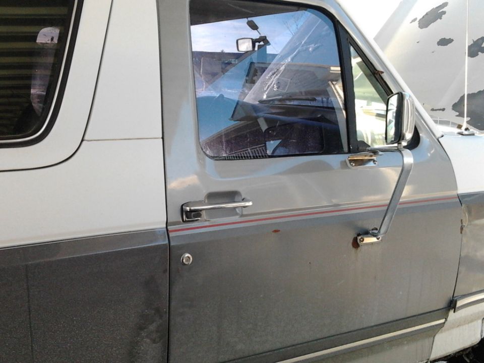 Mismatched door and paint crumpled/scraped off the hood.