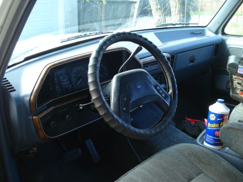 1989 Ford F-250 - Interior view of a 1989 Ford F-250 truck, including the dashboard and steering wheel.