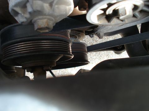 1989 Ford F-250 - Engine pulleys and serpentine belt system shown in detail.