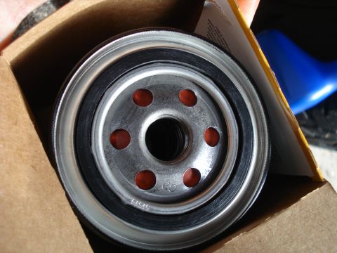 1989 Ford F-250 - Close-up of an oil filter, showing its construction and part number markings.