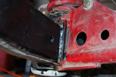 1982 Ford Bronco - Close-up view of a welded metal frame component, possibly from a vehicle's suspension system.