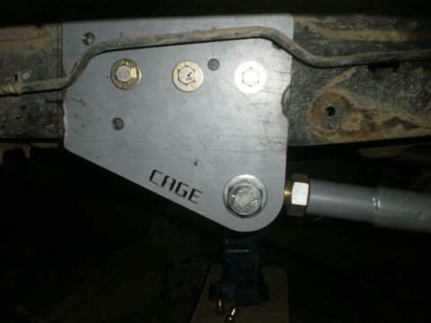 1995 Ford Bronco - A custom cage bracket is attached to the vehicle's frame, indicating aftermarket modifications.