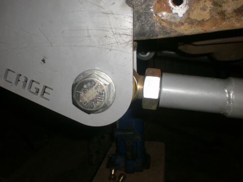1995 Ford Bronco - This image shows a close-up of a suspension part, possibly for a roll cage, with visible text.