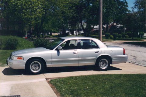 2006 Mercury Grand Marquis - Emma III; silver 1999 Ford Crown Victoria