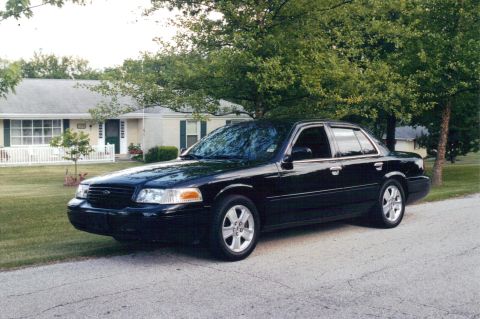 2006 Mercury Grand Marquis - Emma IV; black 2003 Ford Crown Victoria Sport