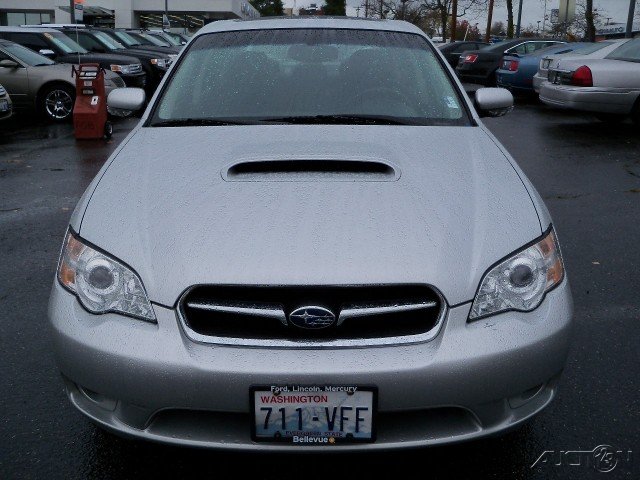 Silver Subaru Legacy with a hood scoop, front view, license plate 711-VFF