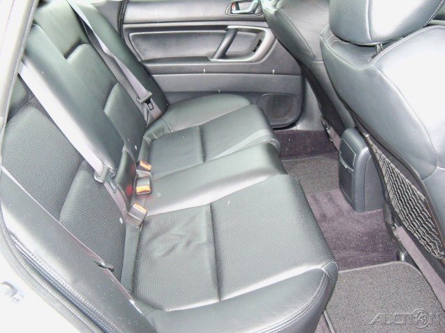 Rear leather seats and floor of a car interior