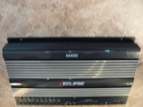 1978 Ford Bronco - Eclipse XA4000 amplifier shown from the top, with visible text and branding.