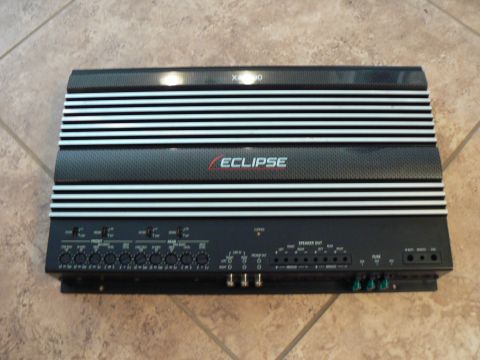 1978 Ford Bronco - An Eclipse car amplifier is shown from the front, displaying its various connection ports and controls.