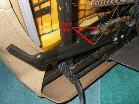 1990 Ford Bronco - Vehicle seat mechanism detail, with red arrows highlighting a spring and linkage.