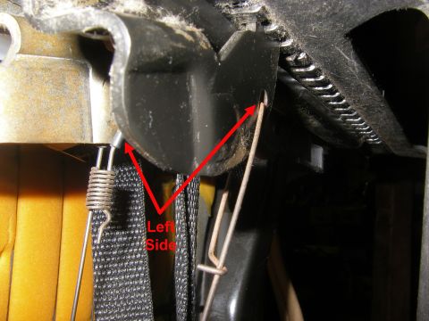 1990 Ford Bronco - This image shows the internal workings of a vehicle seat, focusing on the adjustment mechanism and its associated springs and cables.