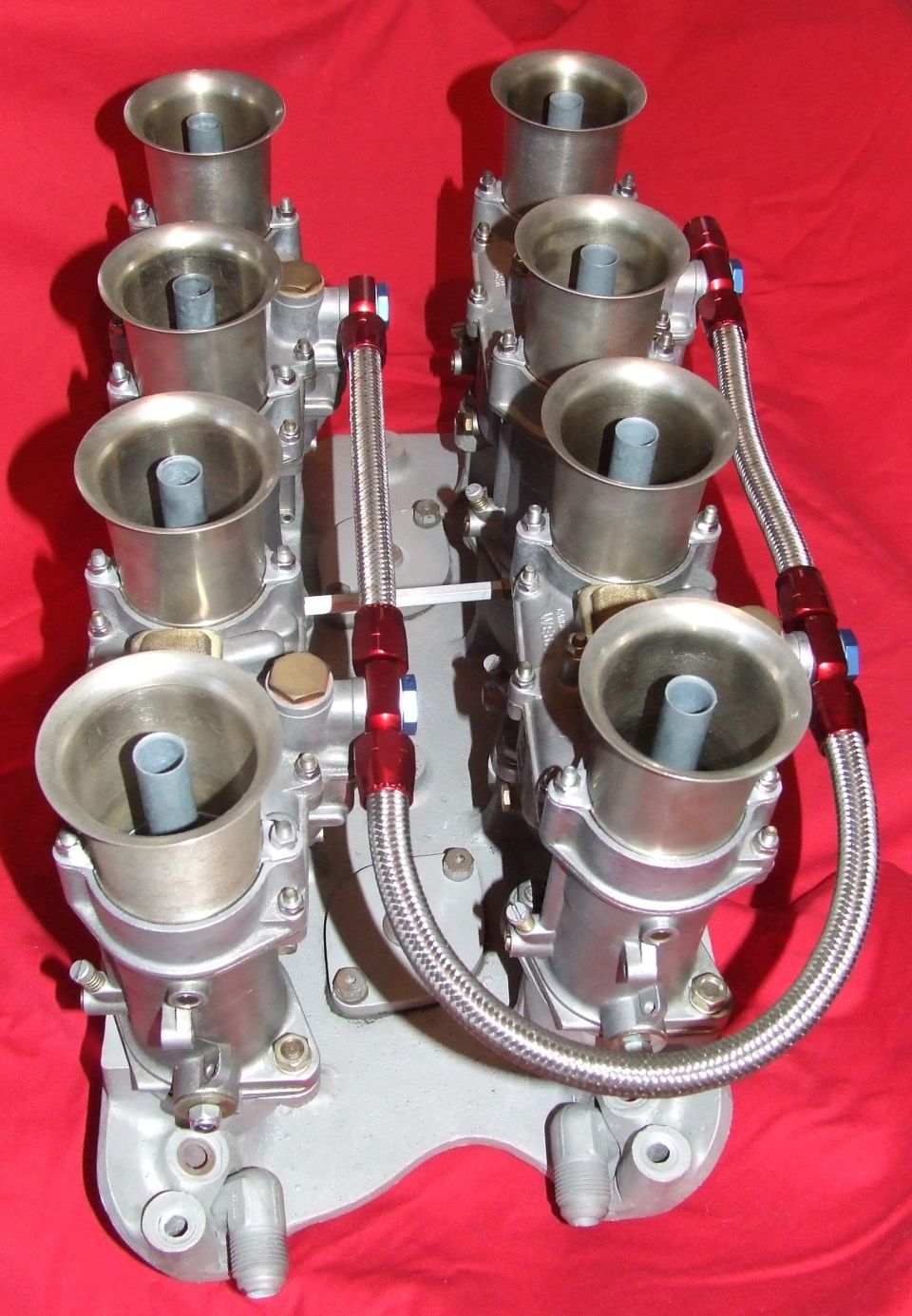 Dual quad carburetors with braided fuel lines