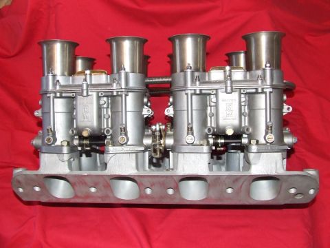 1973 Ford Mustang - This image shows a set of dual Weber carburetors with an intake manifold, not a 1973 Ford Mustang.