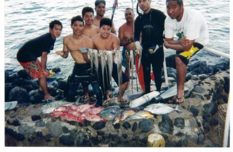 1991 Ford Bronco - A scanned photo of a group of spearfishermen posing on a rocky shoreline with their catch, a string of octopus held up plus red snapper, tr…