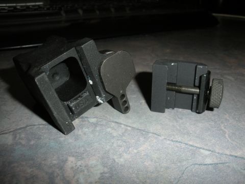 1996 Ford Bronco - This black gun sight mount, marked 'USA', features an adjustable screw for secure attachment.