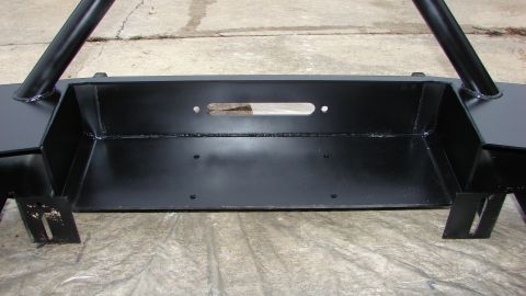 1995 Ford Bronco - This is a close-up view of an aftermarket bumper designed for off-road vehicles, a winch mounting area.
