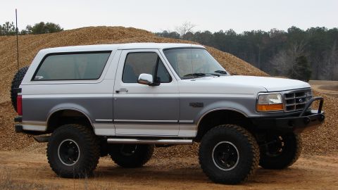 1995 Ford Bronco - This 1995 Ford Bronco features a two-tone paint scheme and off-road modifications.