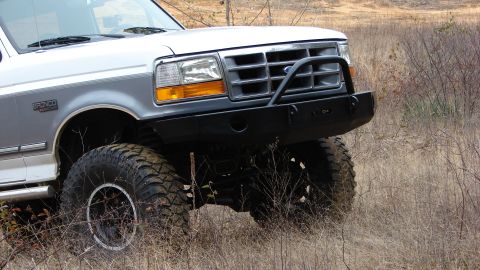 1995 Ford Bronco - Front view of a 1995 Ford Bronco, modified with a heavy-duty bumper and off-road tires.
