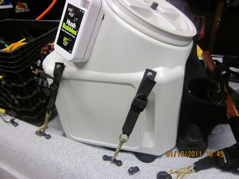 1953 Ford Mainline - A white cooler with a digital air pump device attached is secured with straps.