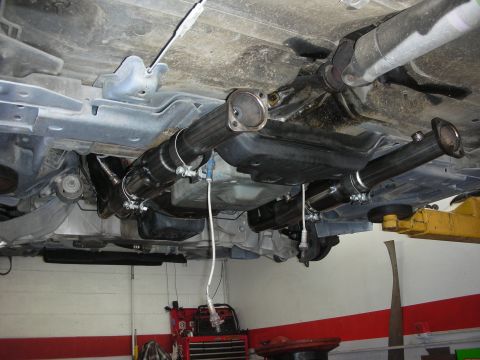 2004 Ford Crown Victoria - Custom exhaust system installation showing headers and catback pipes.
