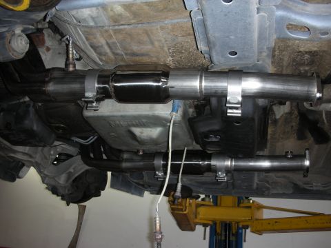 2004 Ford Crown Victoria - Custom exhaust system installed on a vehicle, stainless steel pipes and a catalytic converter.