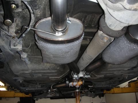 2004 Ford Crown Victoria - Custom exhaust system components are visible from underneath the vehicle.
