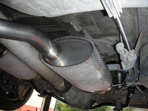 2004 Ford Crown Victoria - Custom exhaust system components are visible from underneath the vehicle.