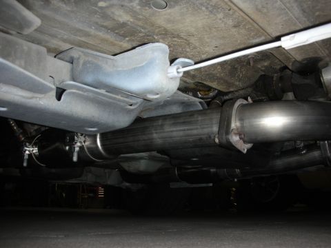 2004 Ford Crown Victoria - Custom exhaust system components are visible from underneath the vehicle.