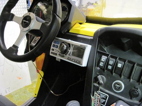 2005 Ford Excursion - Dashboard and steering wheel of a Can-Am side-by-side vehicle.