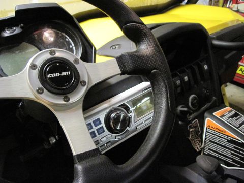 2005 Ford Excursion - The "can-am" logo is visible on the steering wheel of this vehicle's interior, which also features a radio and dashboard controls.