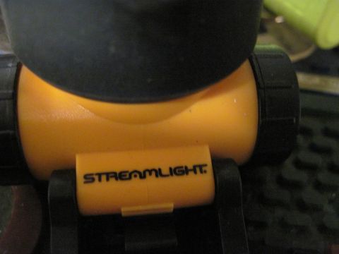 2005 Ford Excursion - A close-up view of a Streamlight brand flashlight, showing its branding and construction.