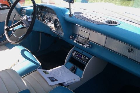 1991 Ford LTD Crown Victoria - The dashboard and interior of a classic car, a distinctive blue color scheme and vintage instrumentation.