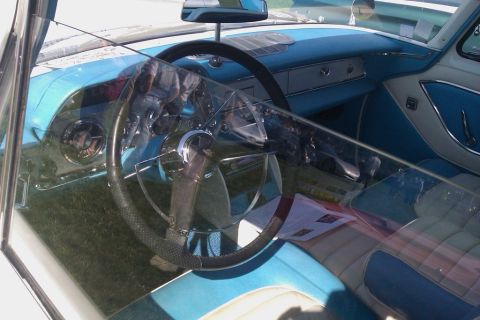 1991 Ford LTD Crown Victoria - The interior of a classic car, likely from the late 1950s, features a two-tone color scheme.
