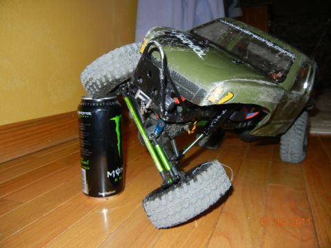 1996 Ford Bronco - RC rock crawler with a Monster Energy can for scale. The vehicle is green and has 'AXIAL RACING' text.
