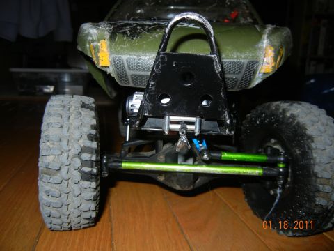1996 Ford Bronco - This remote control vehicle features a custom black bumper and off-road tires, viewed from the rear.