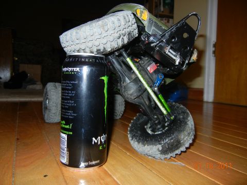 1996 Ford Bronco - An RC car is balanced on a Monster Energy can, displaying its undercarriage and wheels.