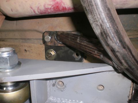 1995 Ford Bronco - Close-up of vehicle frame components, including exhaust pipe and mounting hardware. Supermotors.net logo is present.