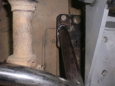 1995 Ford Bronco - Undercarriage view shows a welded bracket attached to a pipe, with some visible part numbers.