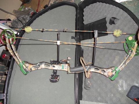 1992 Jeep Cherokee - A compound bow, partially disassembled and stored in a protective case, is shown in this image.