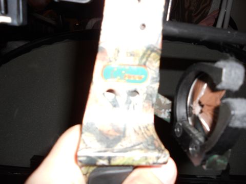 1992 Jeep Cherokee - Close-up of a compound bow with a camouflage pattern and a visible manufacturer's logo.