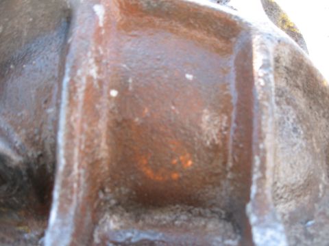 1968 Shelby GT500 - Close-up of a weathered differential housing, showing texture and discoloration.