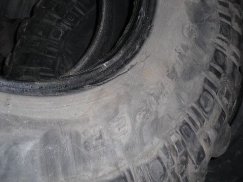 1991 Ford Bronco - Close-up view of a tire's tread pattern showing significant wear.