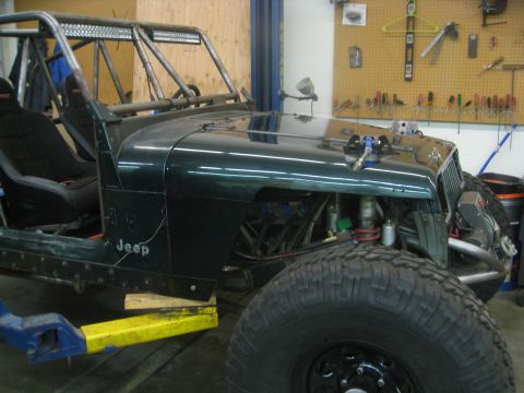 1994 Jeep YJ - This 1994 Jeep YJ is being modified with a roll cage and large off-road tires.