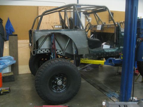 1994 Jeep YJ - This 1994 Jeep YJ is undergoing a custom build with a full roll cage and modified body panels.
