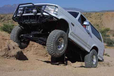 1993 Ford Bronco - This 1993 Ford Bronco is tackling a challenging off-road obstacle.