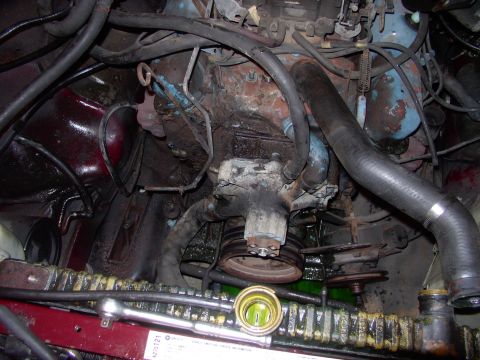 1982 Chrysler New Yorker - Halfway torn down, with all the belt driven accessories off it. Dirty enough for you ? Well just feast on the original paint on the left fr…