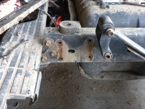 1989 Ford Bronco - Close-up of a 1989 Ford Bronco's frame, highlighting suspension components and a shackle flip modification.