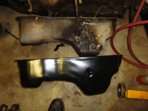 1989 Ford Bronco - Comparison of a used oil pan and a freshly painted replacement oil pan.